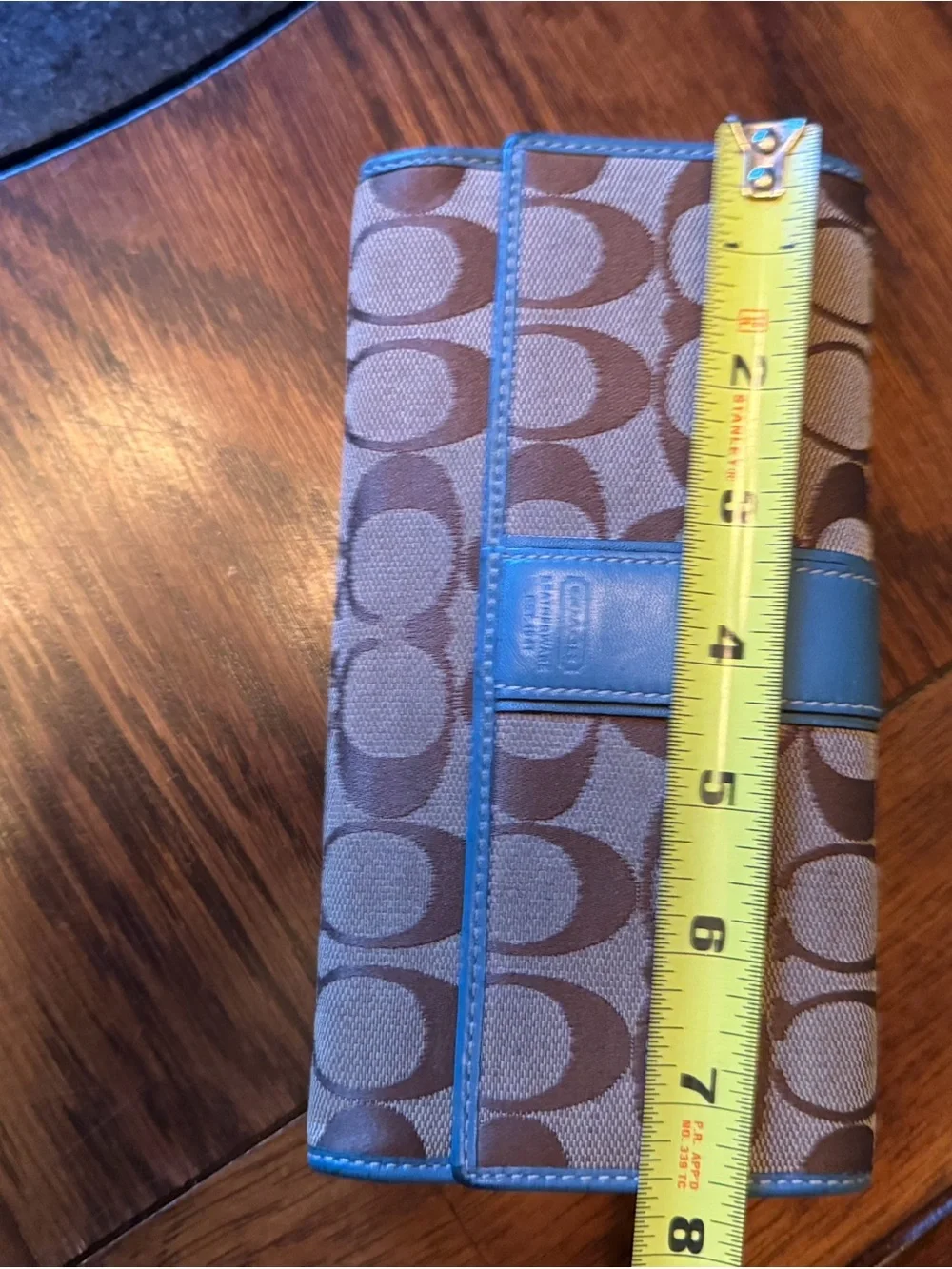 Coach Khaki Signature Canvas Tote with Blue Trim with check book and wallet.